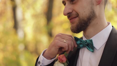 Groom,-brunette-young-man-in-the-yellow-autumn-park.-Wedding-day.-Businessman