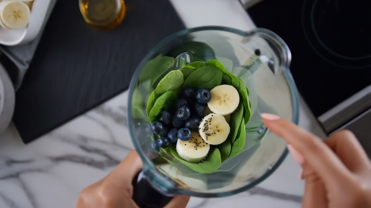 Preparing a Healthy Smoothie with Spinach, Blueberries, and Bananas