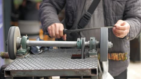 knife sharpening on a manual grinder