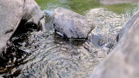 Water-flowing-through-rocks-in-slow-motion