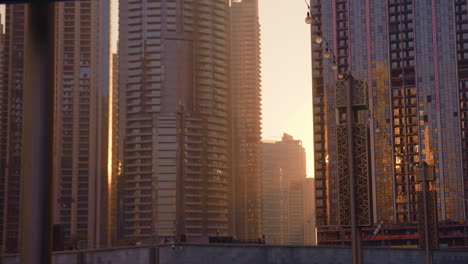 sunset in the middle of skyscrapers, downtown, dubai mall, united arab emirates, middle east