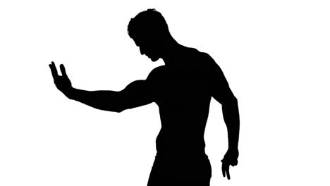 muscular silhouette of man flexing muscles