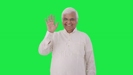 happy indian old man waving hand green screen