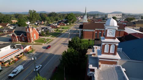 courthouse aerial flyover with churches in background in shepherdsville kentucky