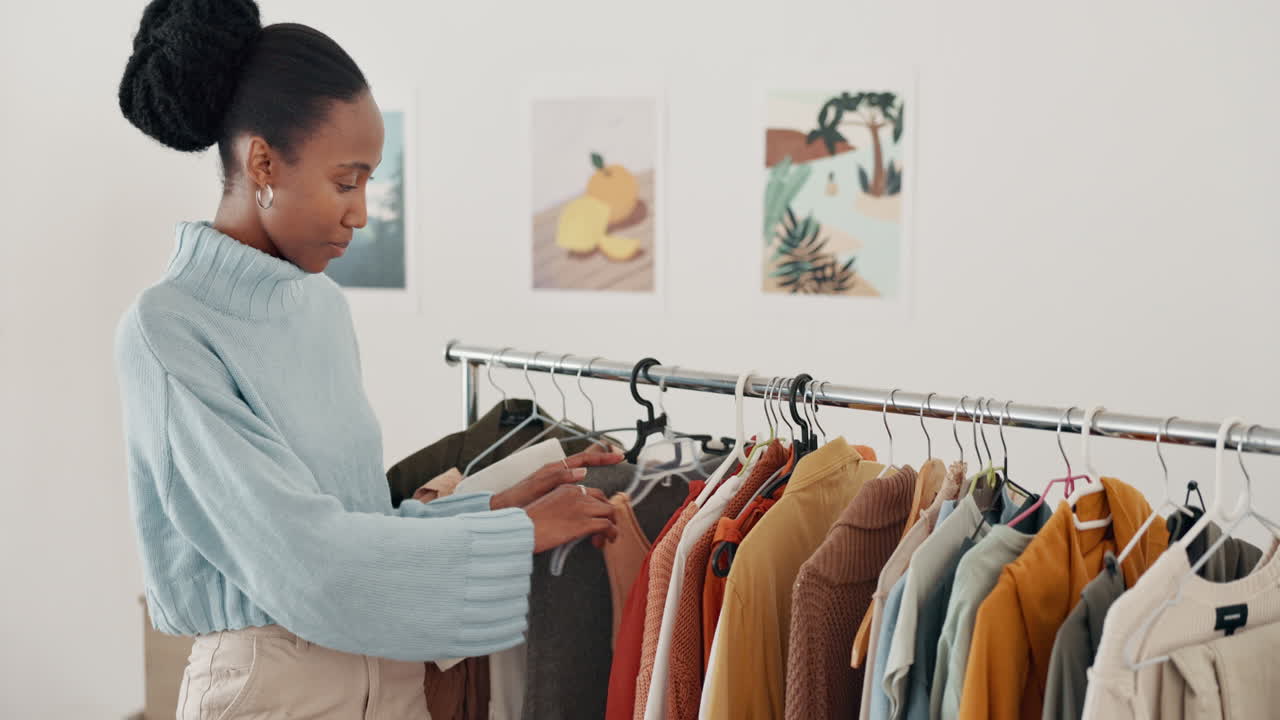 Woman Choosing Clothes from a Rack