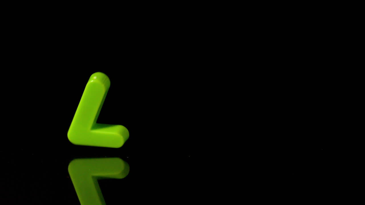 Green number seven falling on black background
