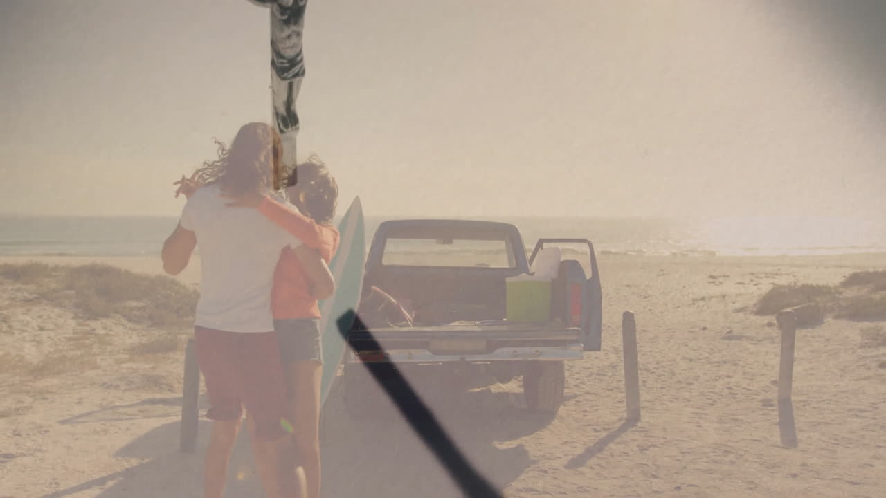 Embracing couple near pickup truck on beach, enjoying ocean view and sunshine