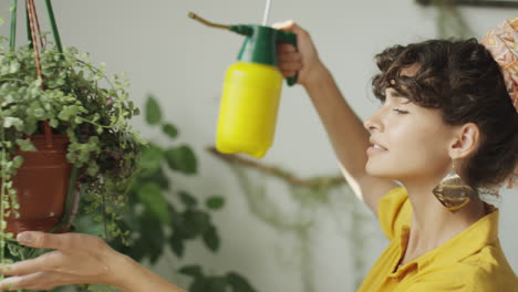 girl caring for indoor houseplants