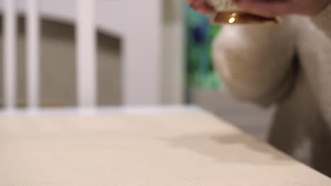 lady hands grabbing a cup of hot coffee and pick it up from the table