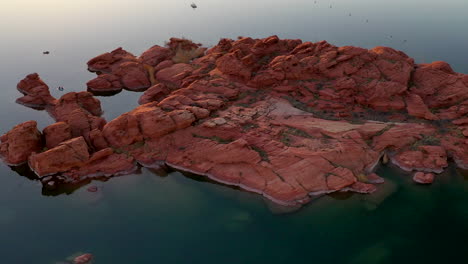 sand hollow state park, utah, usa. beautiful aerial panning shot of sand hollow water reservoir and red sandstone. establishing shot of the area