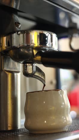 espresso machine pouring coffee