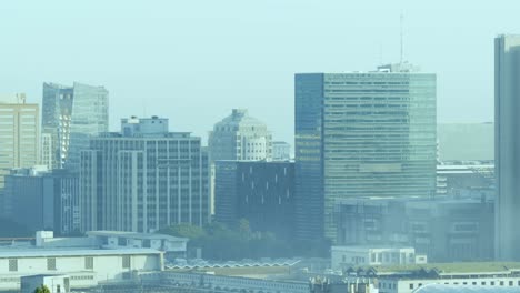 General-view-of-cityscape-with-multiple-modern-buildings-and-cloudless-sky