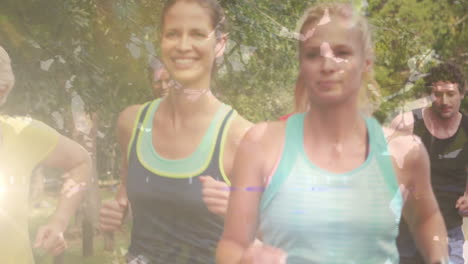 animation of group of happy caucasian male and female runners in park over leaves