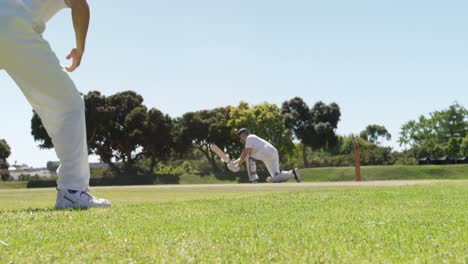 batsman playing a sweep shot during cricket match