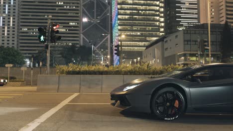 lamborghini aventador in hong kong city at night