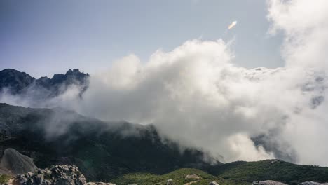 time lapse of low clouds swirling about on a bright, sunny day, in madeira