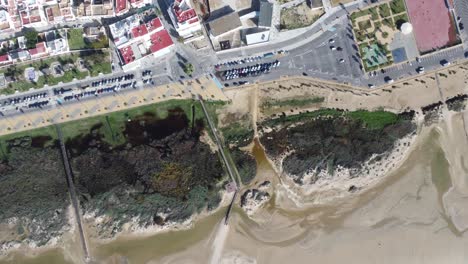 drone-flies-over-the-famous-white-city-of-conil-in-andalusia-in-southern-spain,-sunny-weather