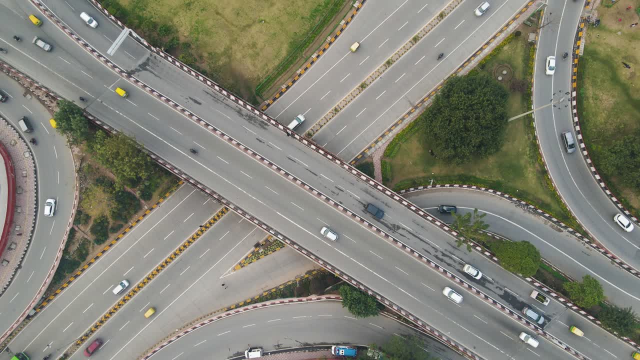 Aerial drone shot offering a cinematic top-down view of a flyover in ...