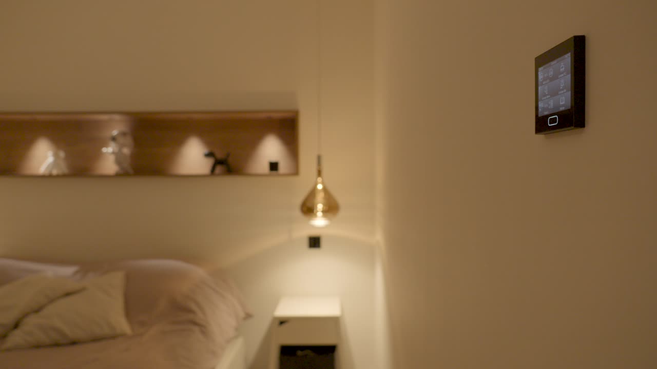 A stylish and modern indoor space featuring a sleek bed and coated electric light wire ceiling base