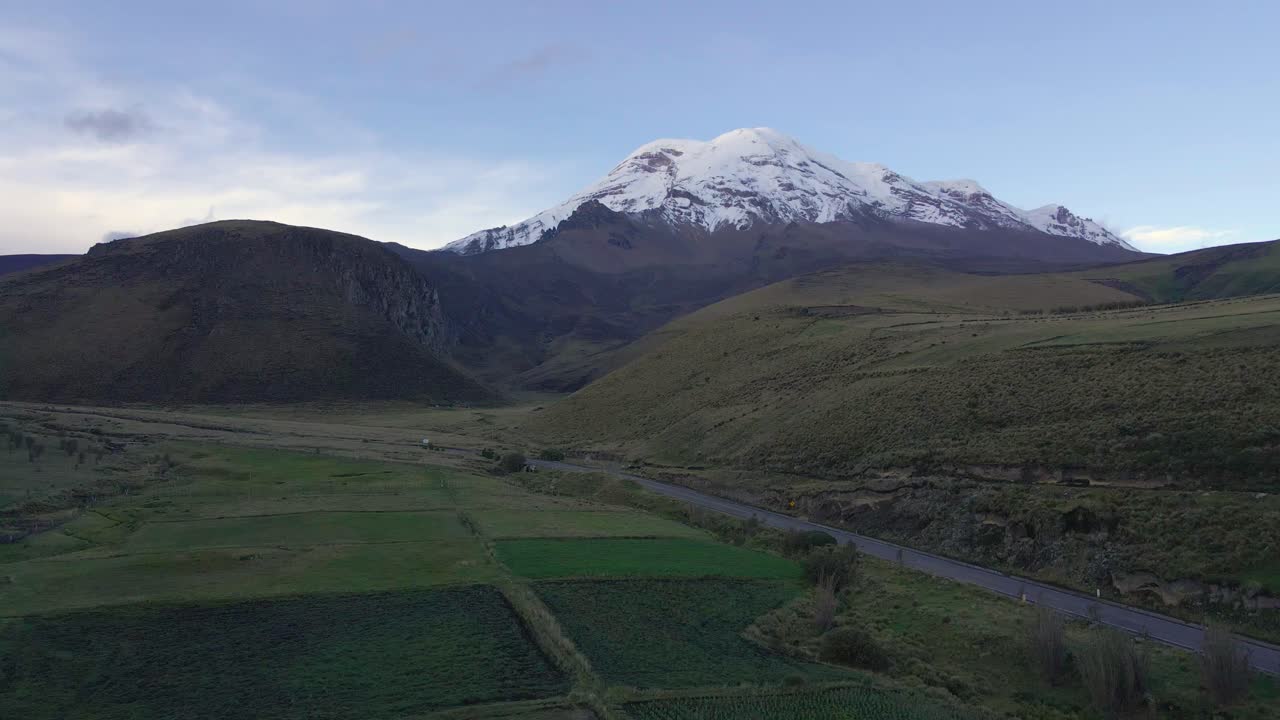 Inactive stratovolcano of Chimborazo in Ecuador, fly backward aerial view
