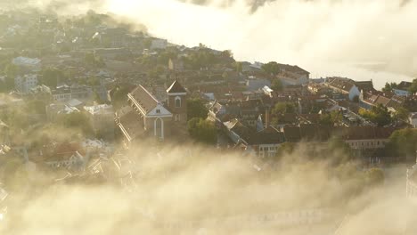 fog over kaunas old town, lithuania