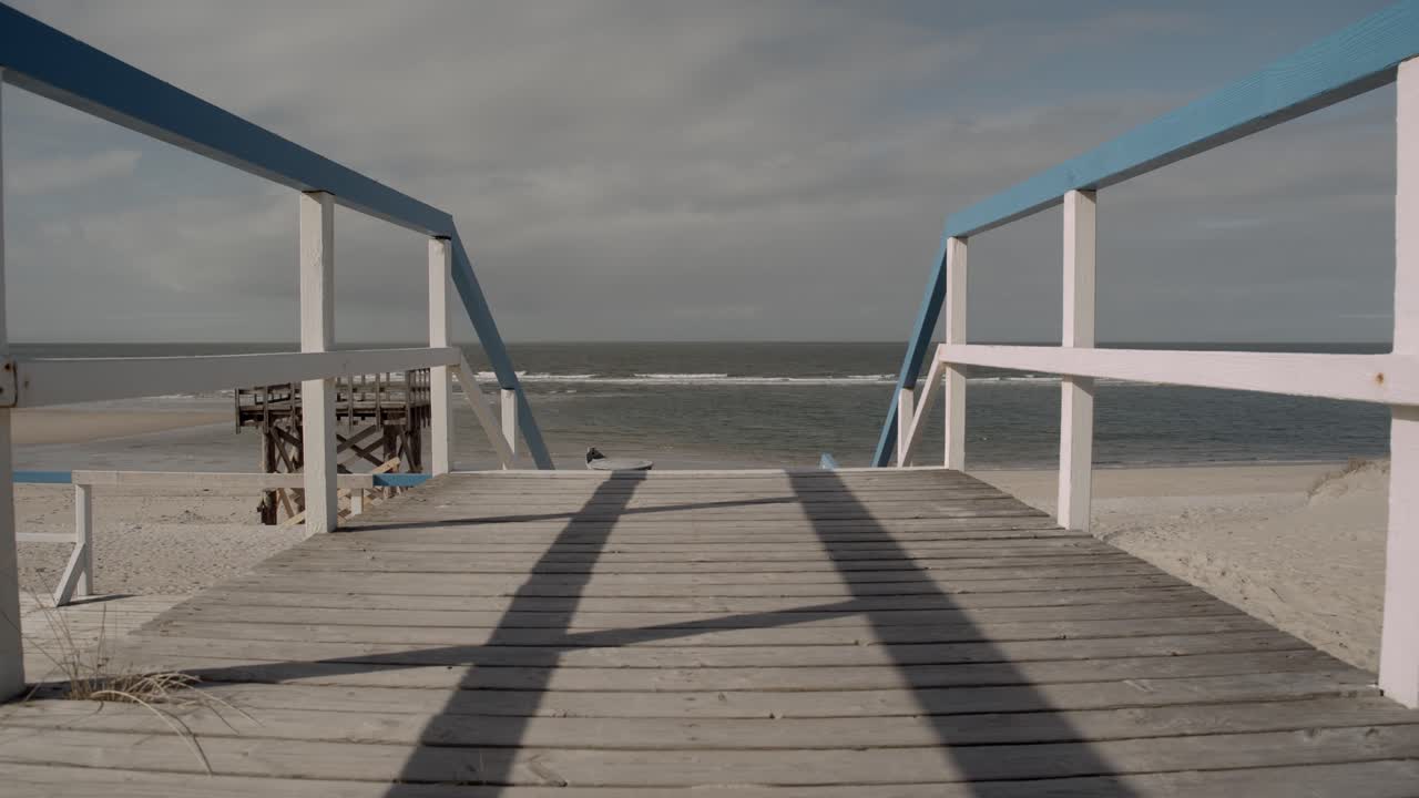 Wooden pier in front of the west beach of sylt