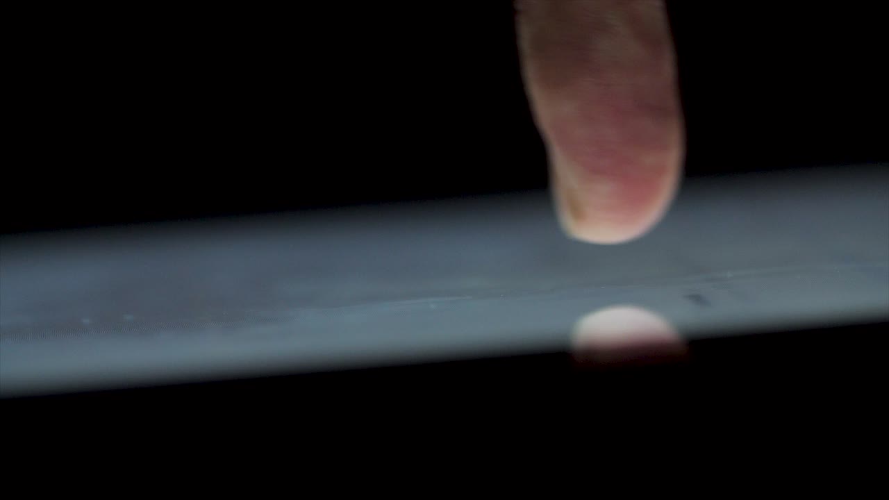 Finger touching a smartphone screen