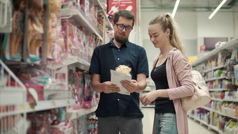 couple shopping for toys in a store