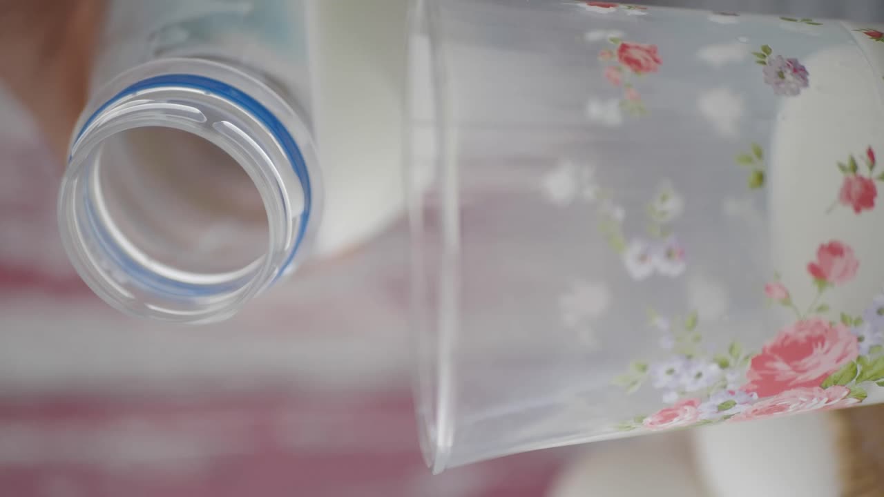 Pouring milk into a floral container