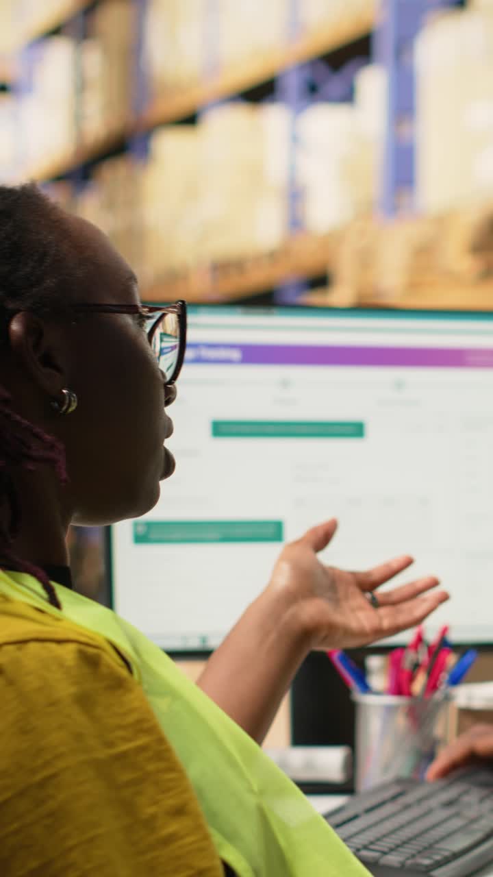 Vertical Video Black warehouse manager expressing her disappointment for her staff