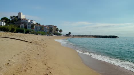 Platja-de-les-Barques-sea-field-Maresme-Barcelona-Mediterranean-coast-plane-close-to-turquoise-blue-transparent-water-beach-without-people