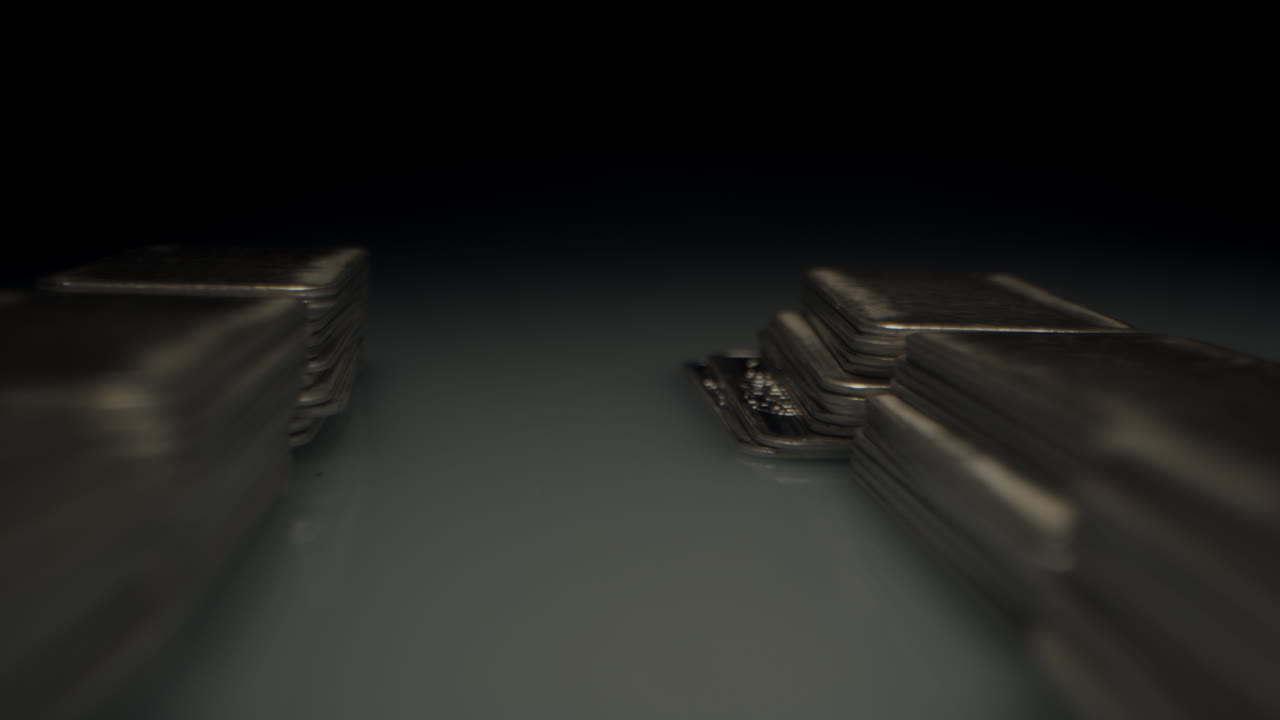 Cinematic macro dolly in between stacks of neatly organized piles of silver bars in a dark room