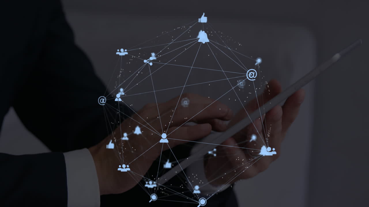 Man uses tablet, animating a global network web with floating icons.