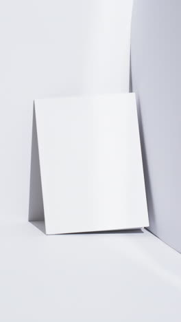 vertical video of book with white blank pages and copy space on white background