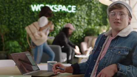 portrait attractive young caucasian man student smiling happy entrepreneur enjoying successful career in trendy startup office