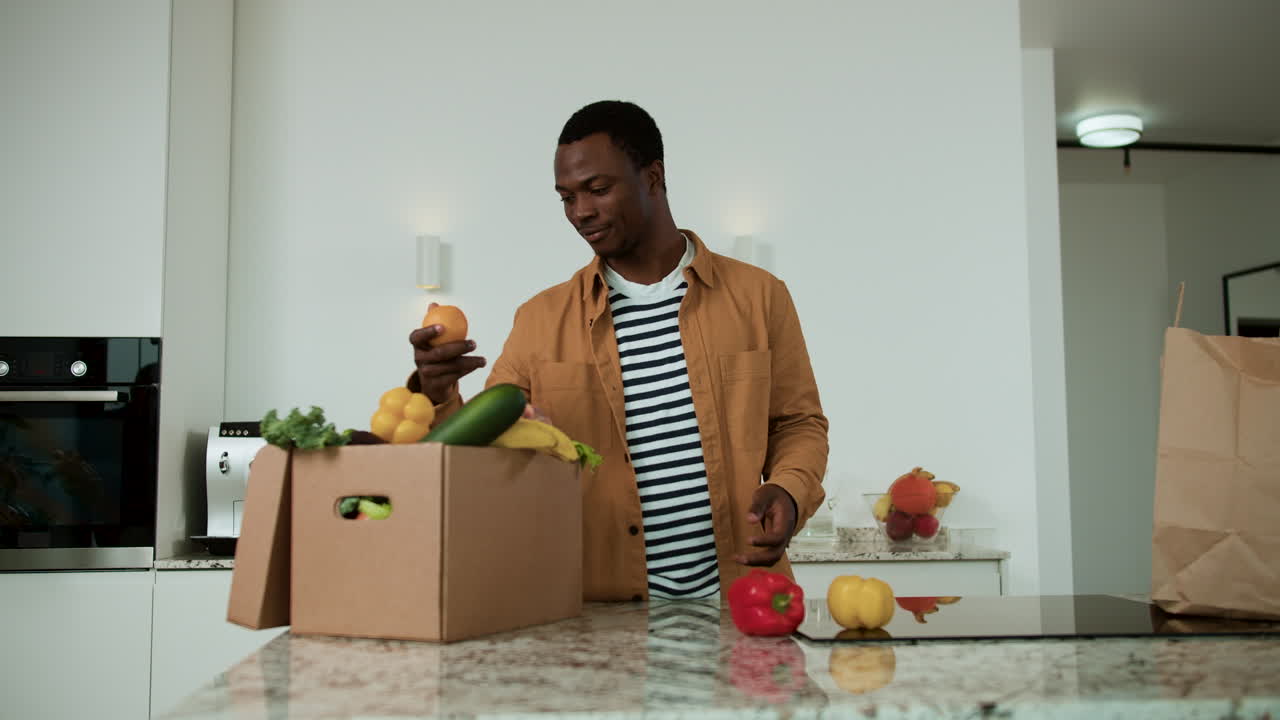 Man unpacking groceries