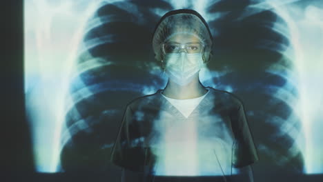 female doctor in protective uniform posing on chest x-ray