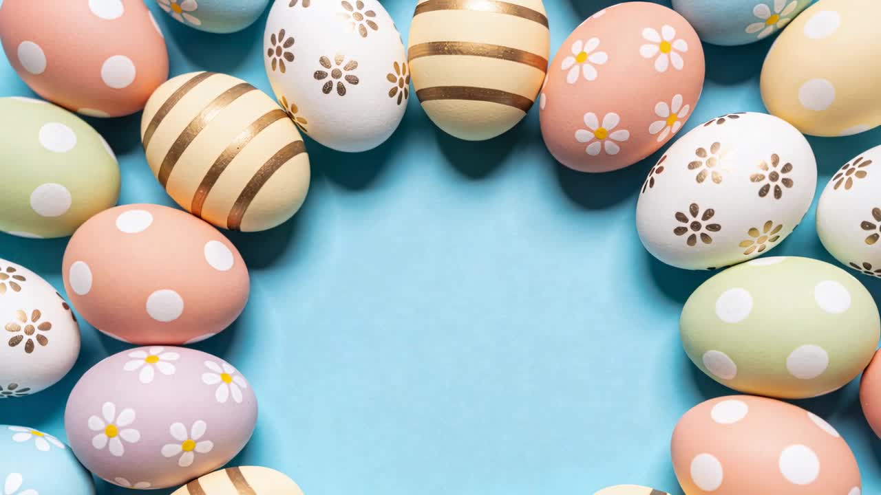 Playing wreath animation decorated eggs rotating clockwise inward on blue center, gold accents