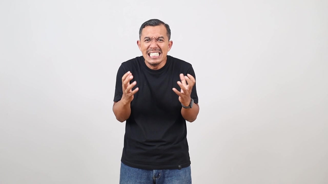 Anger, emotional, angry, scared Asian man looking at camera. Human emotions, facial expression concept