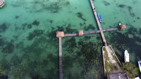 aerial top down view of fancy luxury resort in bacalar mexico quintana roo state with stunning blue clear water lake lagoon