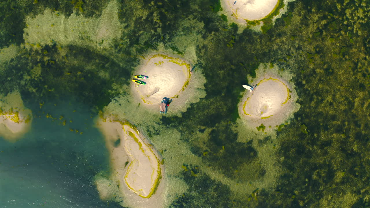 Aerial view of small sand islands in the middle of the sea at sunny summer day