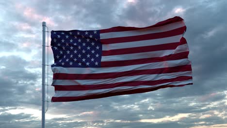 realistic flag of united states waving in the wind against deep dramatic sky. 4k uhd 60 fps slow-motion