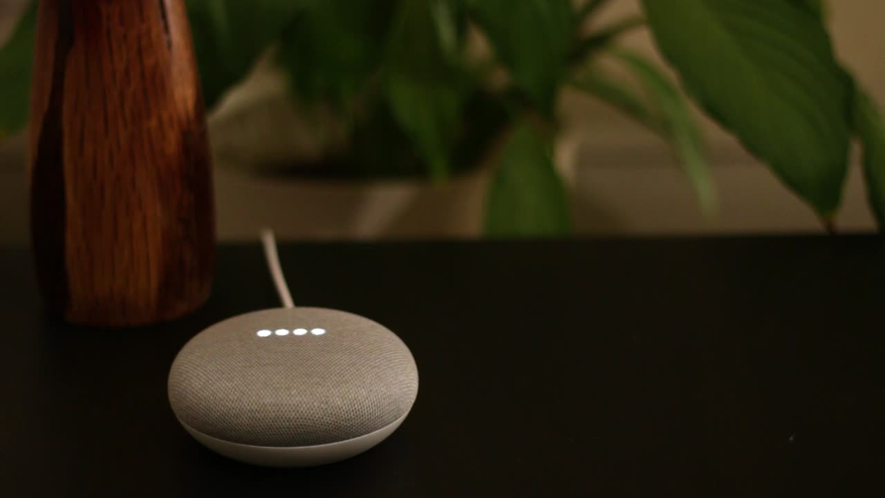 Voice controlled mini smart speaker gadget responds to commands