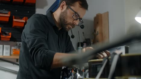 man working on a machine in a workshop