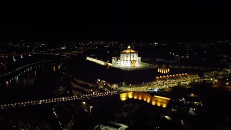 Nighttime-Drone-shots-of-the-Douro-River-in-the-heart-of-Porto,-Portugal