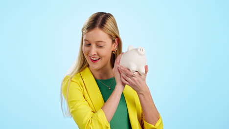 Woman,-smile-and-listening-to-piggy-bank