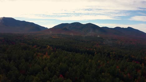 ski mountain in new england with fall foliage colorful tree leaves and fog