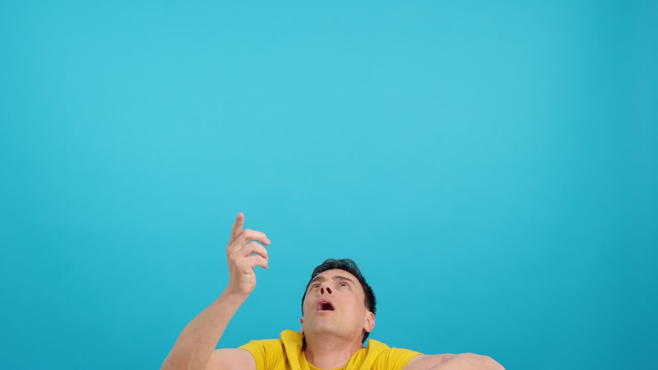 Man looking up and pointing