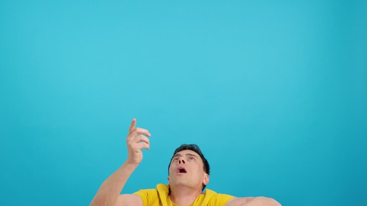 Man looking up and pointing