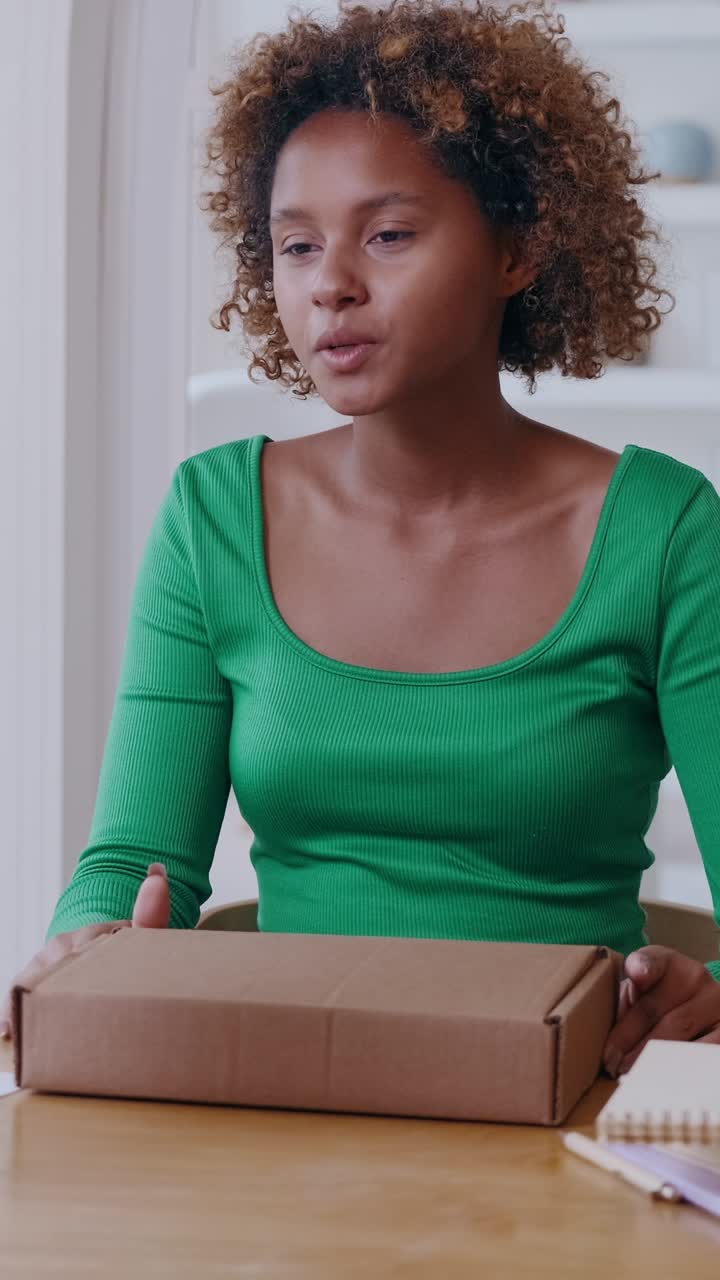 Exciting unboxing experience with a young woman at home